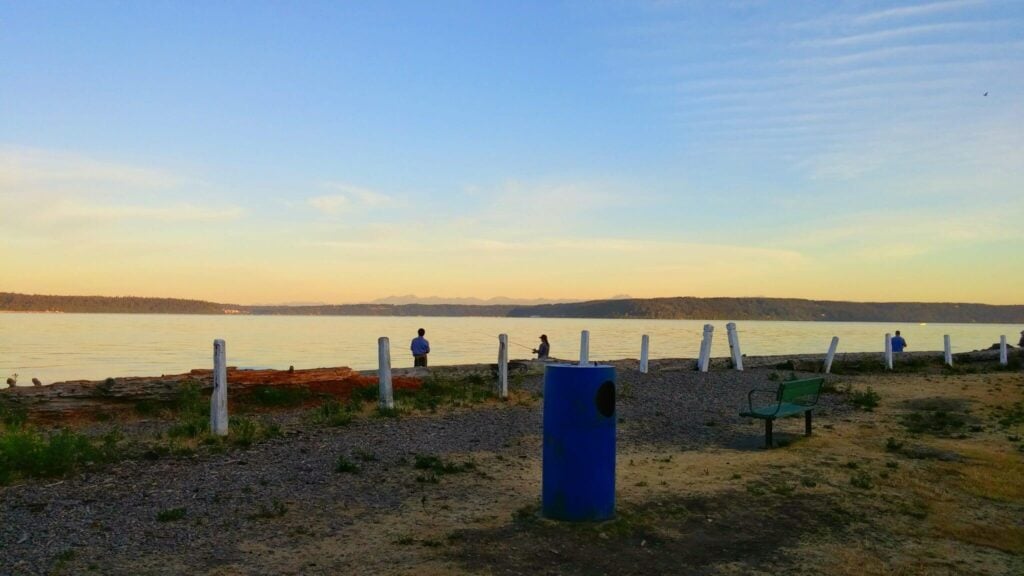 Fisherman on Browns Point Beach at sunrise