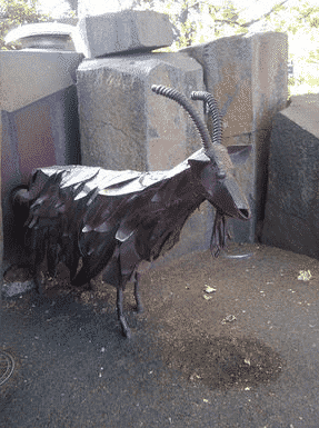 Garbage eating goat statue