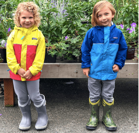 two children wearing bogs boots, explore washington state
