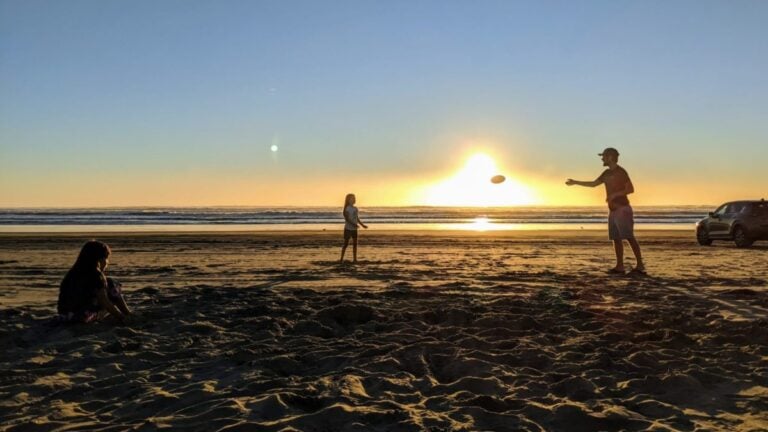 playing frisbee at the beach