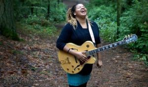 Stephanie Anne Johnson With Guitar in forest
