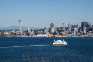 view of a Washington ferry on the water against the Seattle skyline