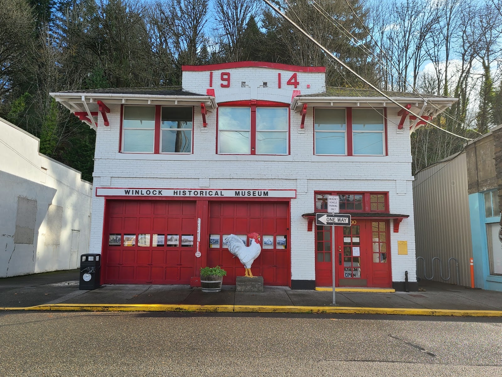 The Winlock Historical Museum in the town's 1914 firehouse, with red doors and a white rooster statue