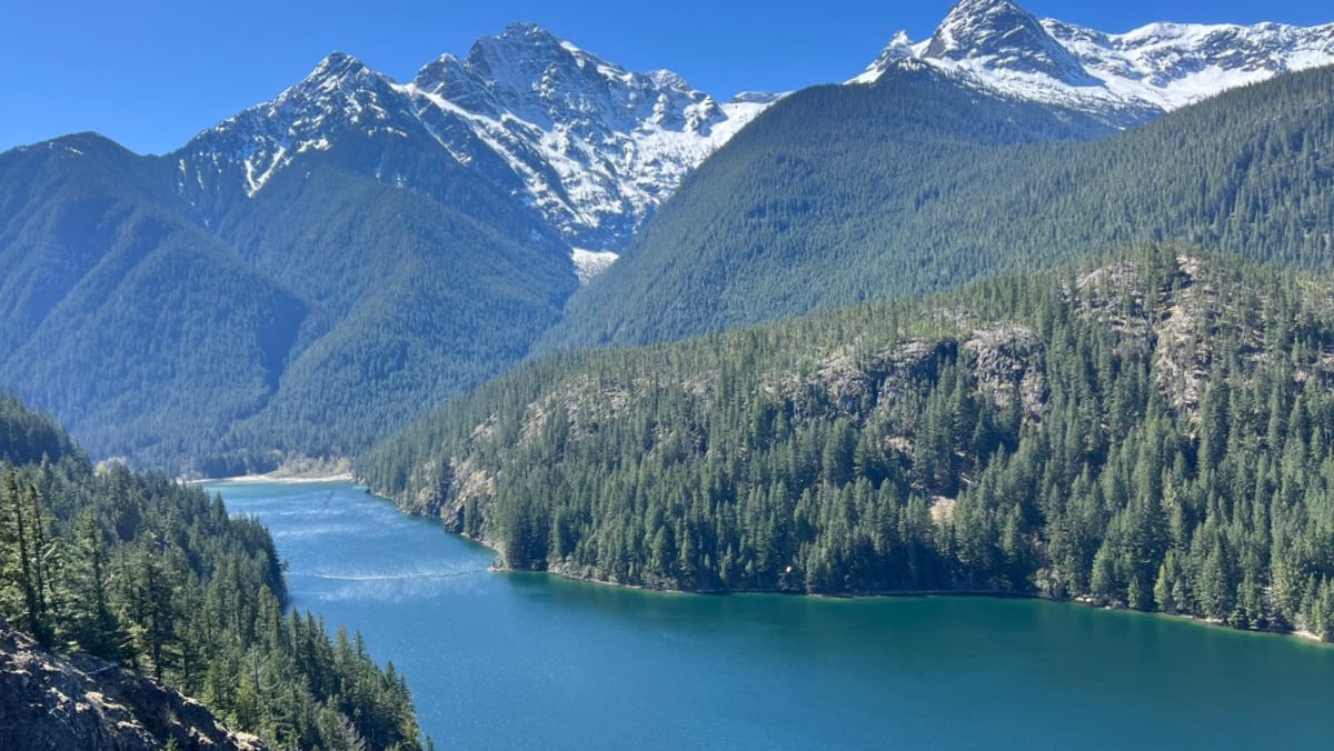 Birding North Cascades Highway SR 20: Diablo Lake panoramic view with turquoise water and snow-capped peaks