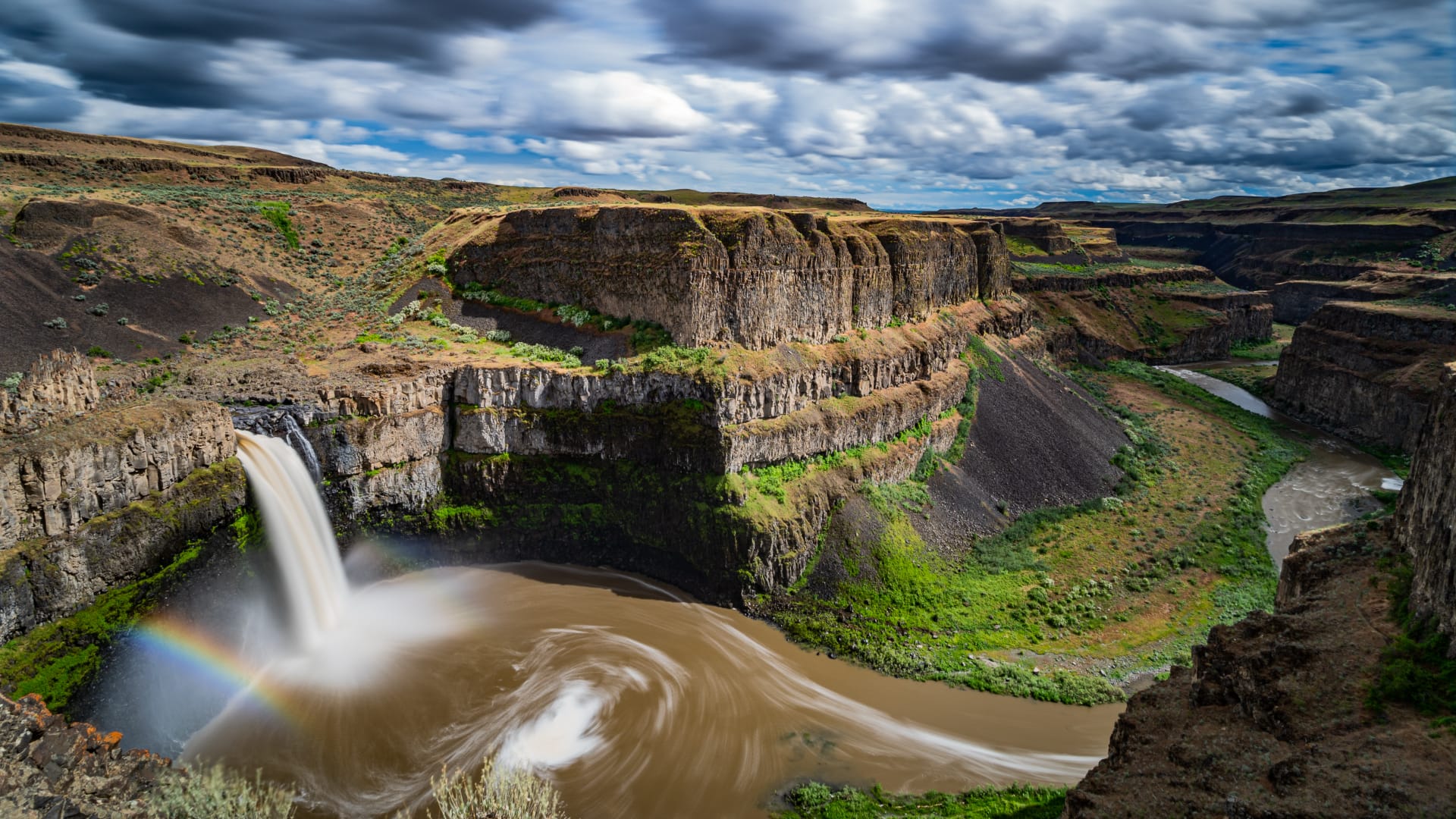 Palouse Falls with a rainbow in the canyon spray in eastern Washington