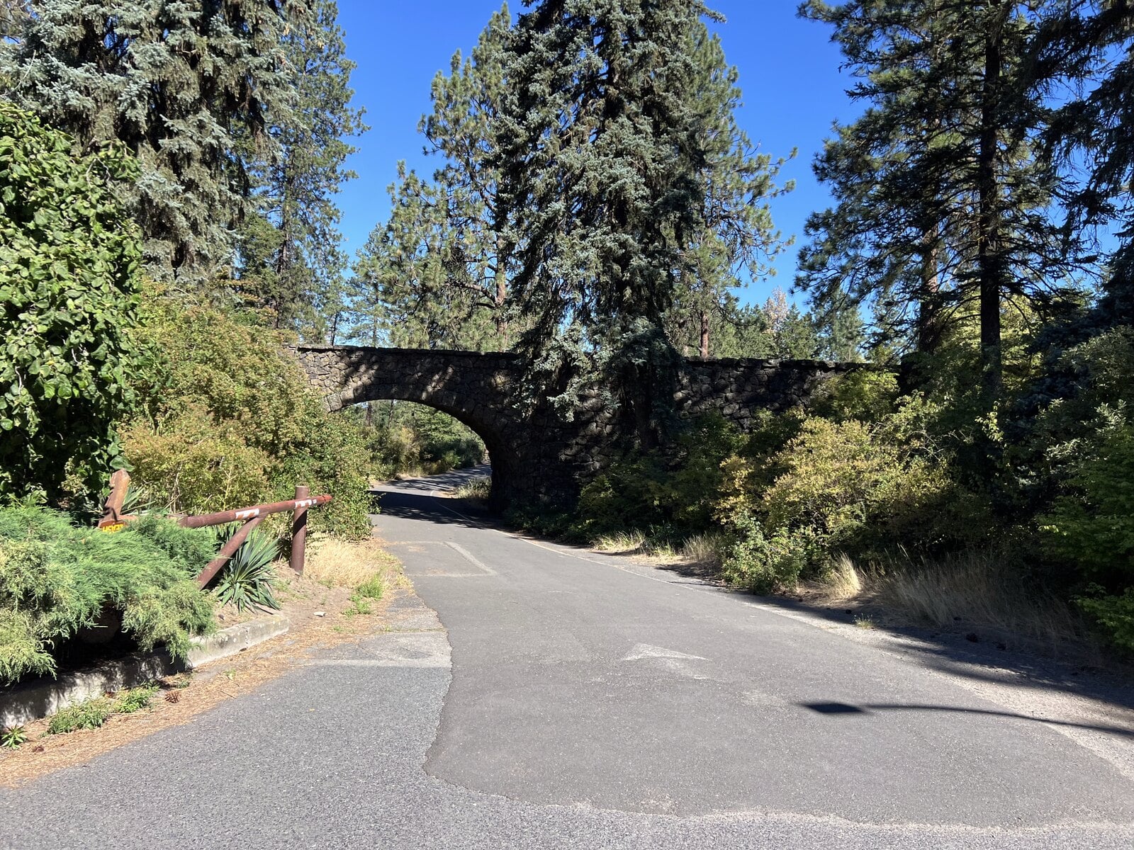 Stone arch bridge over Loop Drive in Manito Park in Spokane
