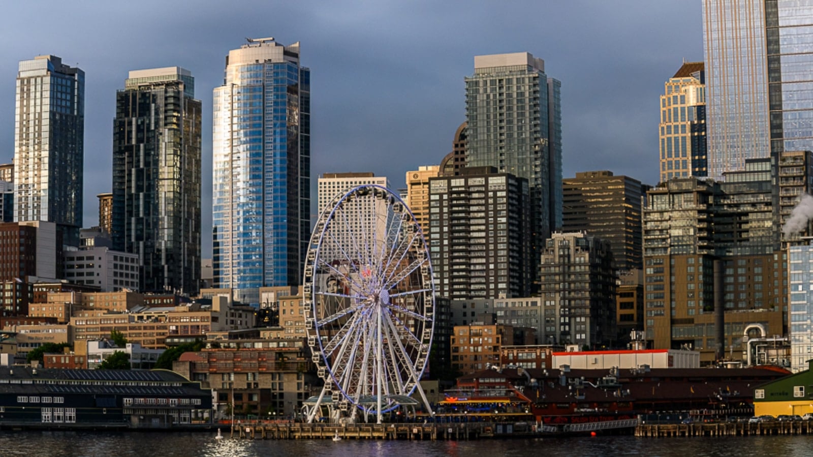 Things to do in Seattle: the Great Wheel and downtown skyline above the Elliott Bay waterfront
