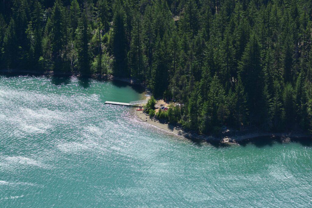 Thunder Point Campground on the turquoise water of Diablo Lake, seen from the Diablo Lake Overlook on the North Cascades Highway