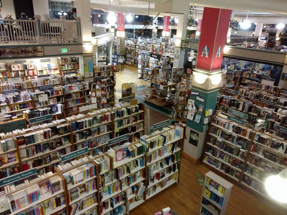 Rows of shelves on the main floor of Auntie's Bookstore, seen from the mezzanine