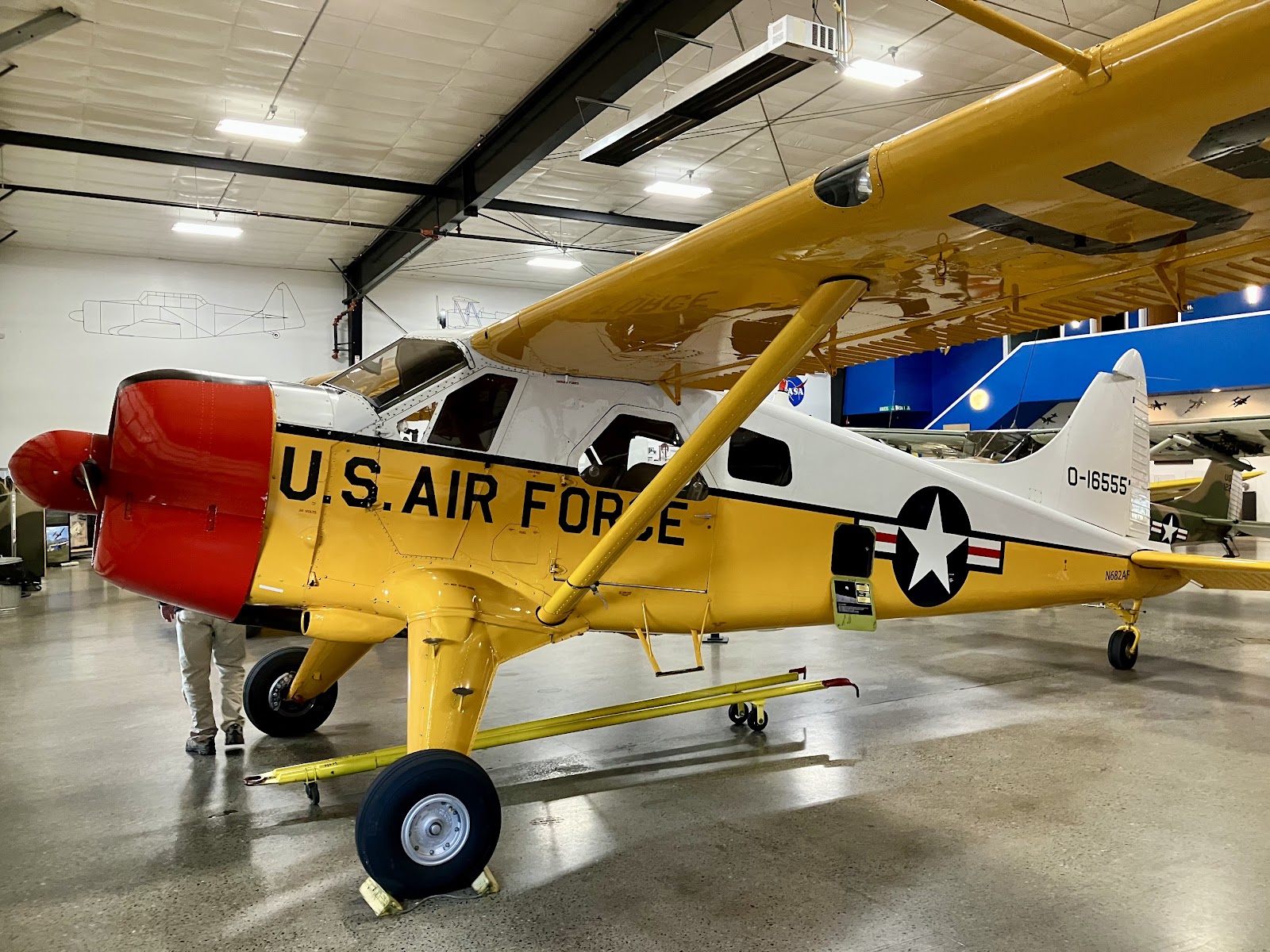 Yellow and white vintage Air Force plane inside the Heritage Flight Museum hangar in Burlington