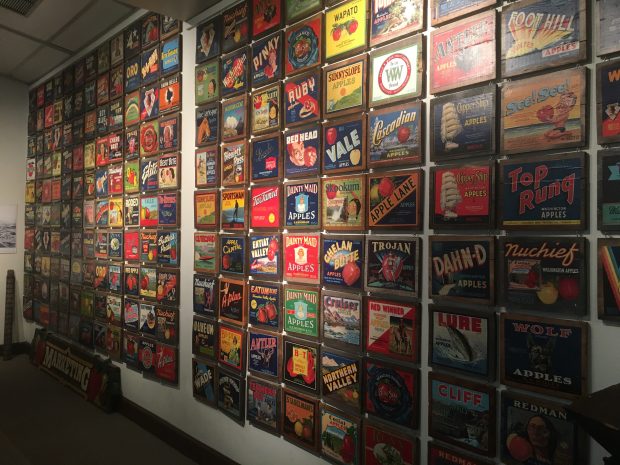 Wall of vintage apple crate labels from the Wenatchee Valley Museum and Cultural Center collection